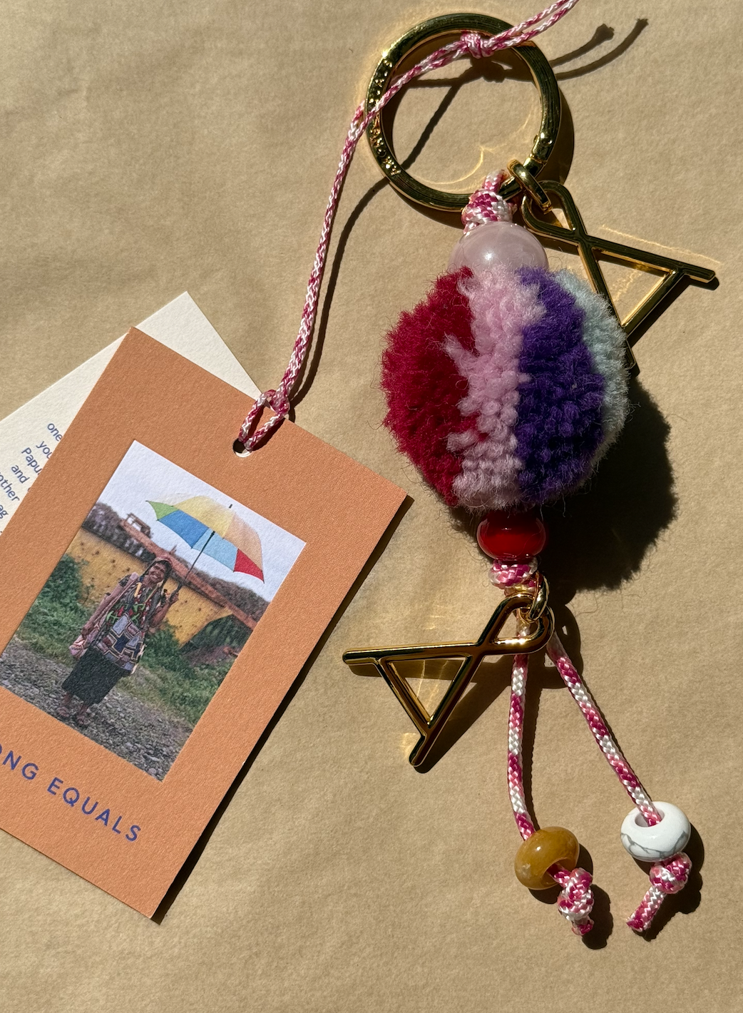 Among Equals pom pom wool adornment